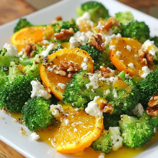 Ensalada templada de brócoli con naranja asada, queso de cabra y nueces